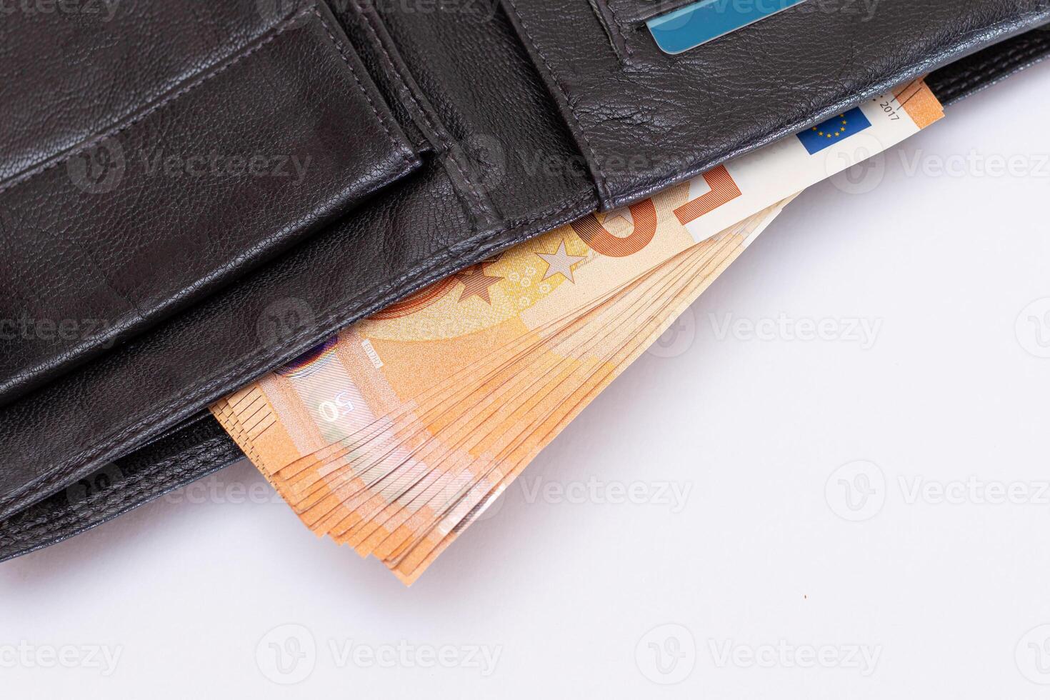 Opened Black Leather Men Wallet with Fifty Euro Banknotes and Bank Cards Inside on White Background. A Purse Full of Money and Credit Cards Symbolizing Wealth, Success and Social Status photo