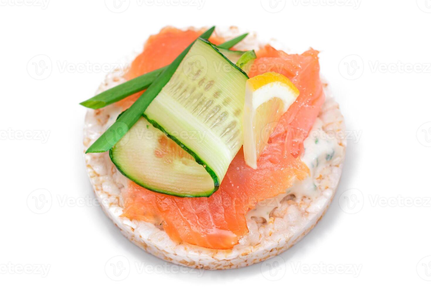 Rice Cake Sandwich with Fresh Salmon, Cucumber, Lemon and Greens - Isolated on White Background. Diet Food. Quick and Healthy Sandwiches. Crispbread with Fresh Fillings. Healthy Dietary Snack photo
