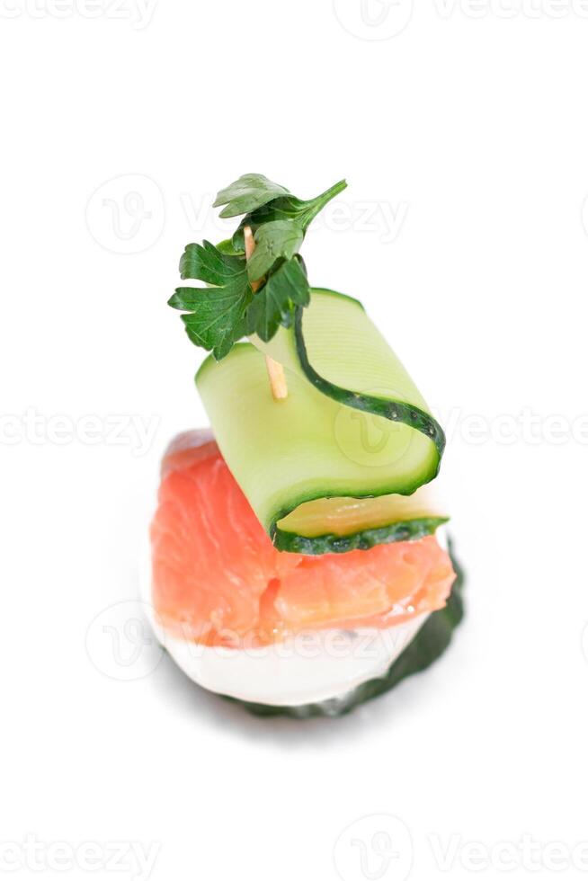 Canapes without Bread with Fresh Salmon, Cucumber and Cream Cheese - Isolated on White Background. Easy Breakfast. Diet Food. Quick and Healthy Sandwiches. Healthy Snacks with Tasty Fillings photo