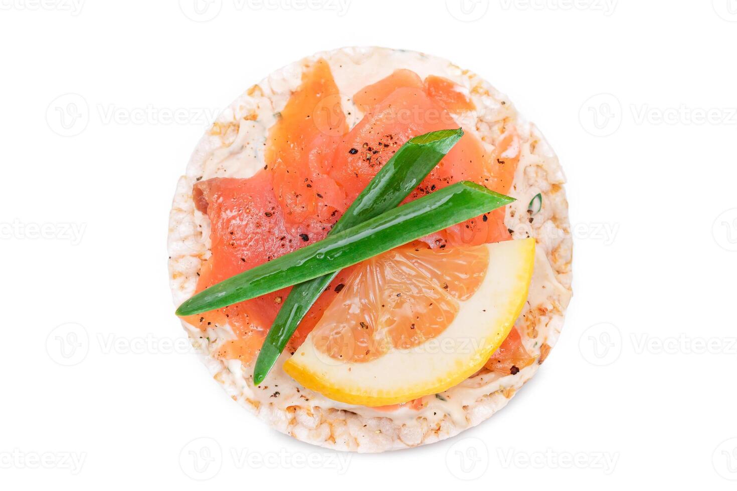 Rice Cake Sandwich with Fresh Salmon, Lemon and Green Onions - Isolated on White Background. Diet Food. Quick and Healthy Sandwiches. Crispbread with Fresh Fillings. Healthy Dietary Snack photo