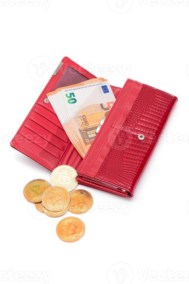 Opened Red Women Purse with 50 Euro Banknotes Inside and Bitcoin Coins - Isolated on White Background. A Wallet Full of Money Symbolizing Wealth, Success, Shopping and Social Status - Isolation photo