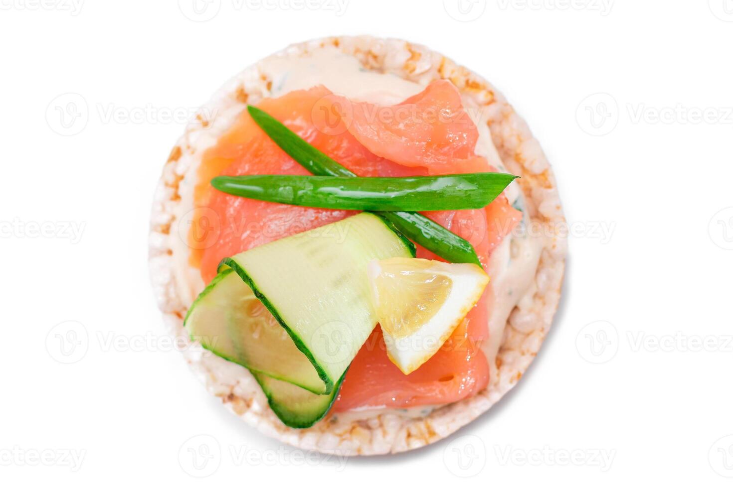 Rice Cake Sandwich with Fresh Salmon, Lemon and Greens - Isolated on White Background. Diet Food. Quick and Healthy Sandwiches. Crispbread with Fresh Fillings. Healthy Dietary Snack photo