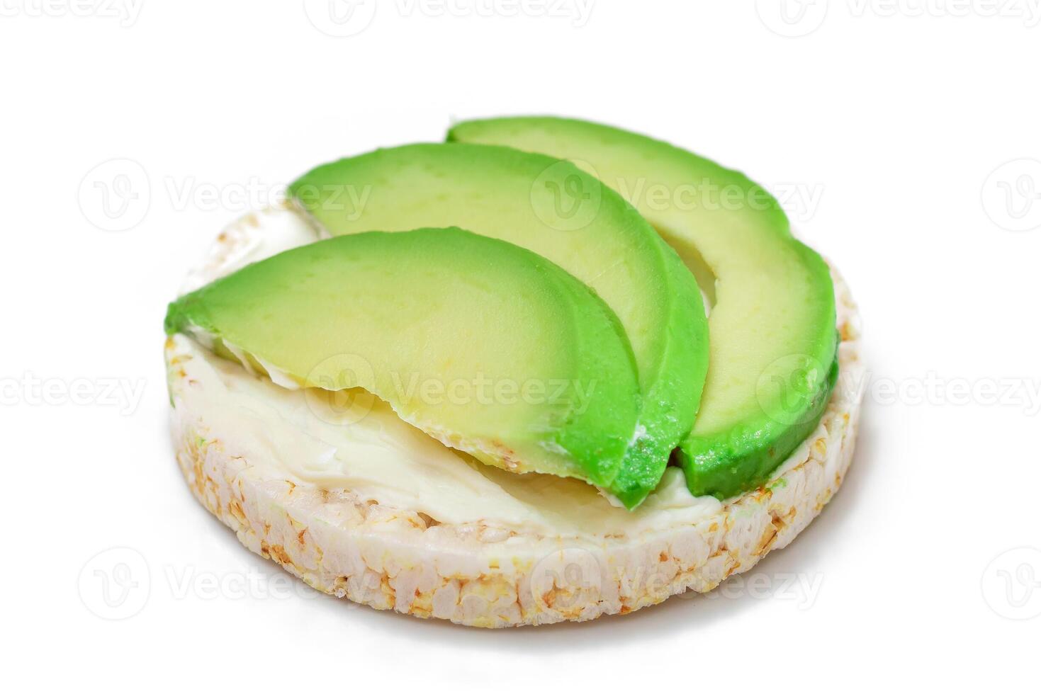 Rice Cake Sandwich with Fresh Avocado and Cream Cheese - Isolated on White. Easy Breakfast. Diet Food. Quick and Healthy Sandwiches. Crispbread with Tasty Filling. Healthy Dietary Snack - Isolation photo