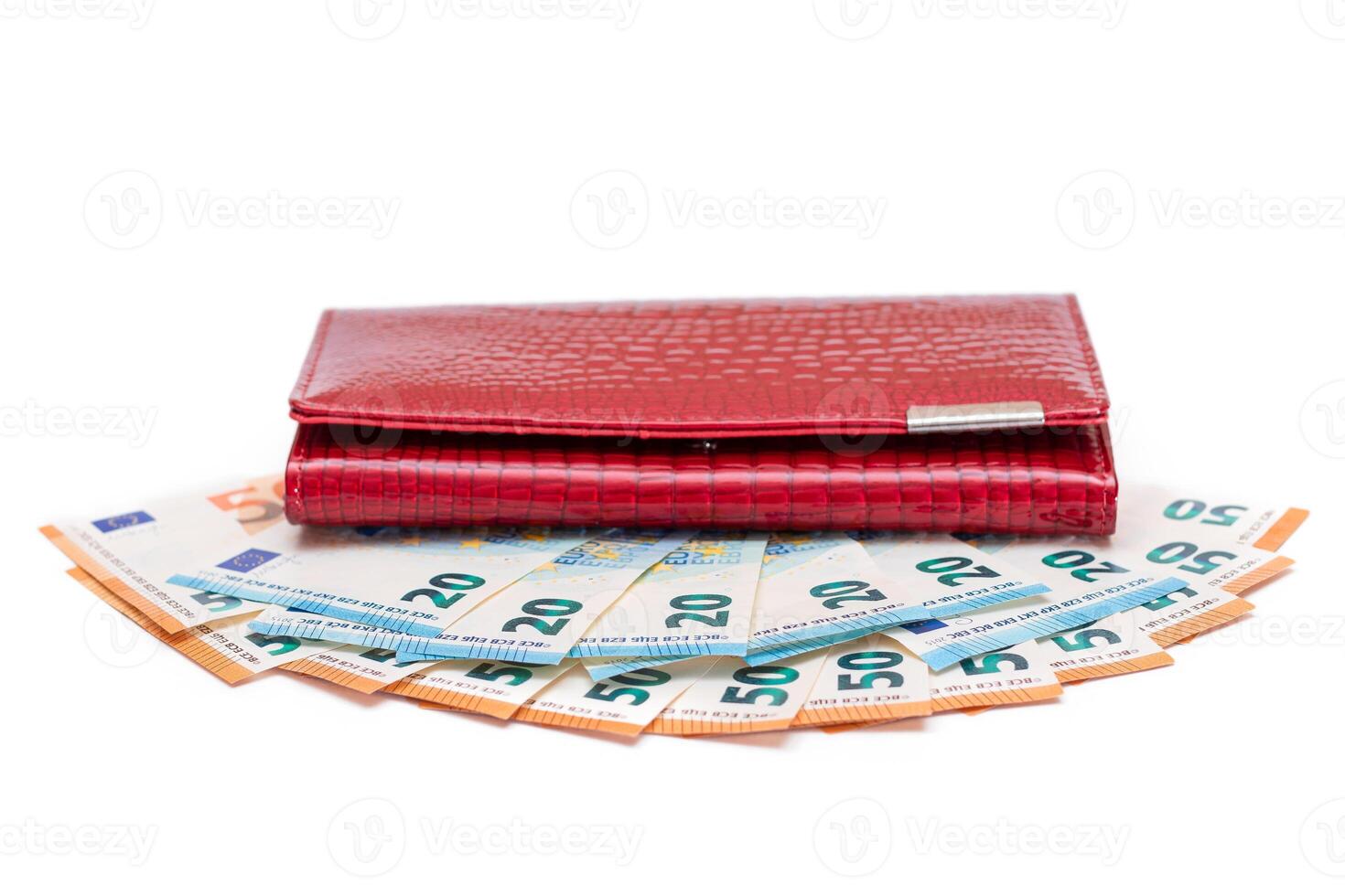 Red Leather Women Purse with Different Euro Banknotes - Isolated on White Background. A Wallet Full of European Union Paper Money Symbolizing Wealth, Success and Social Status - Isolation photo