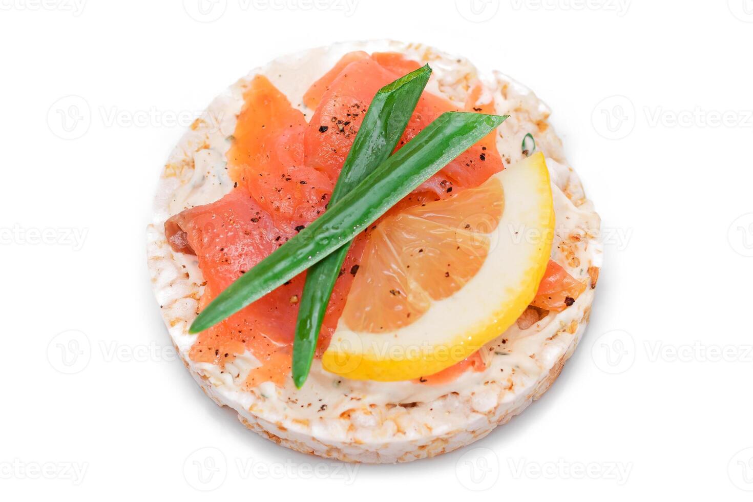 Rice Cake Sandwich with Fresh Salmon, Lemon and Green Onions - Isolated on White Background. Diet Food. Quick and Healthy Sandwiches. Crispbread with Fresh Fillings. Healthy Dietary Snack photo