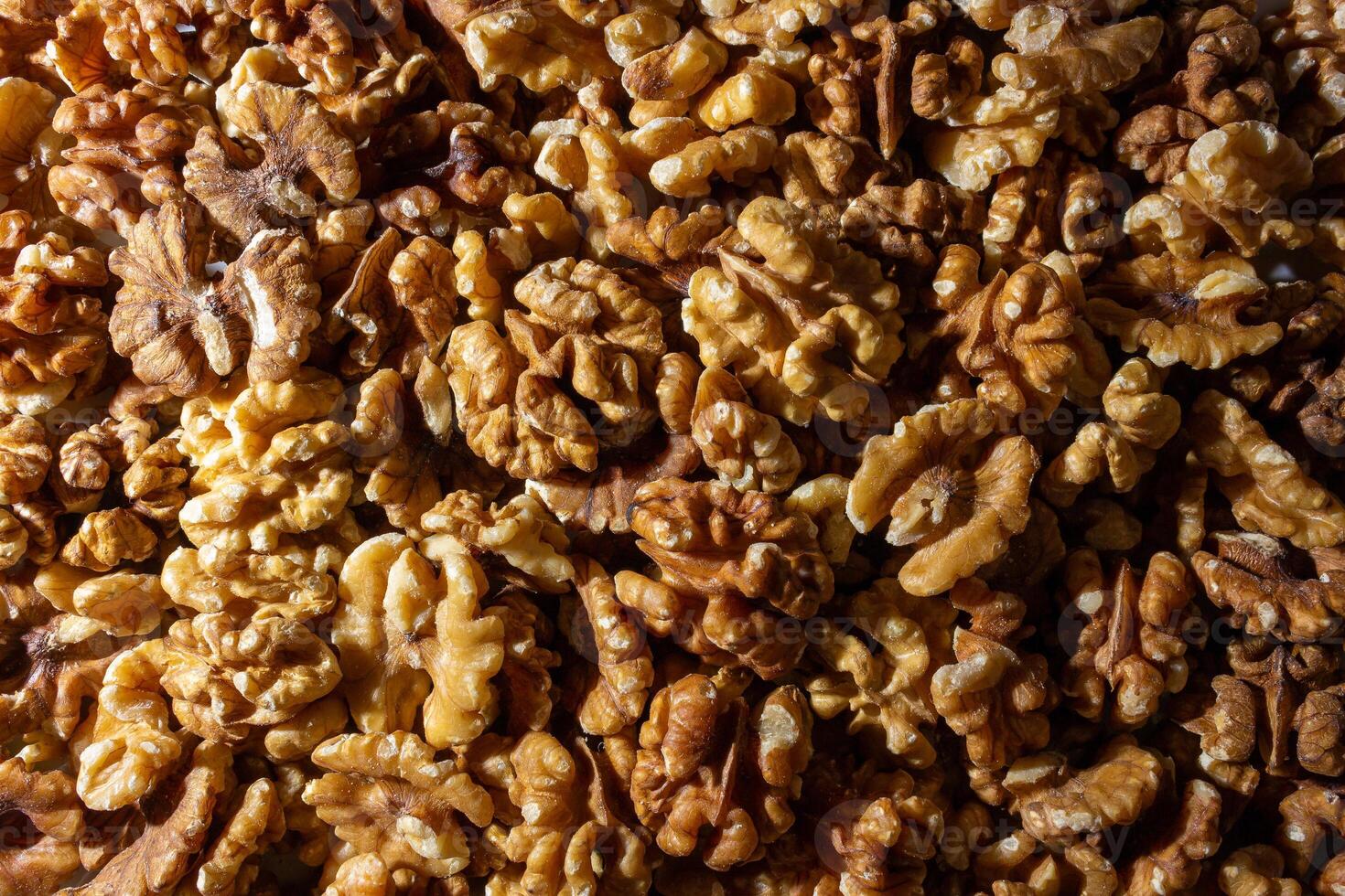 Scattered Shelled Walnuts. Background from Walnut. Natural High-Calorie Snacks photo