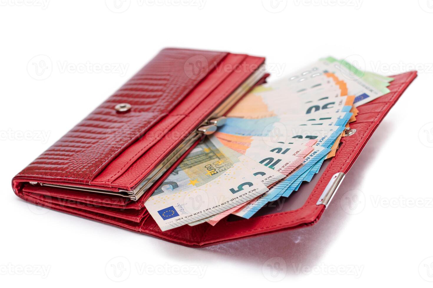Red Leather Women Purse with Different Euro Banknotes - Isolated on White Background. A Wallet Full of European Union Paper Money Symbolizing Wealth, Success and Social Status - Isolation photo