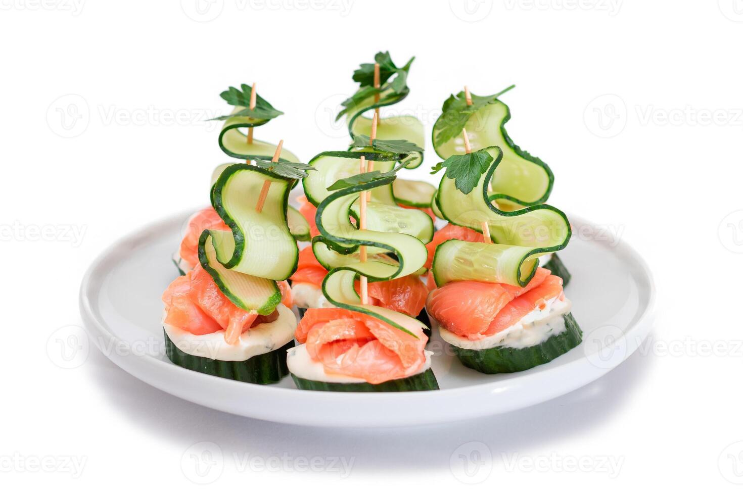 Canapes without Bread with Fresh Salmon, Cucumber and Cream Cheese - Isolated on White Background. Easy Breakfast. Diet Food. Quick and Healthy Sandwiches. Healthy Snacks with Tasty Fillings photo