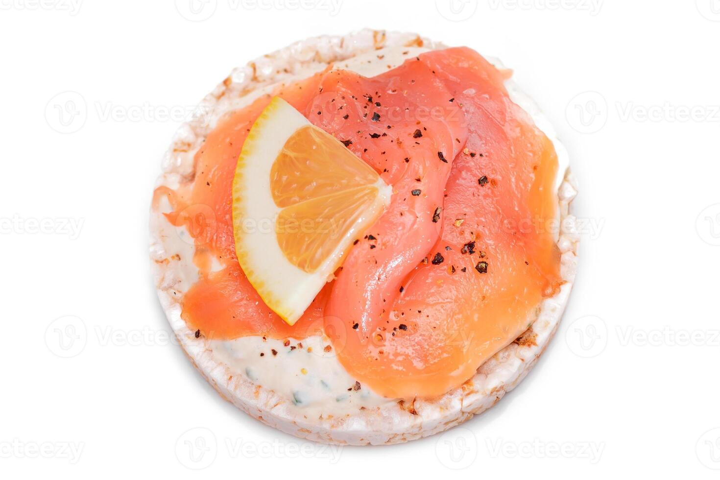 Rice Cake Sandwich with Fresh Salmon and Lemon - Isolated on White Background. Diet Food. Quick and Healthy Sandwiches. Crispbread with Fresh Fillings. Healthy Dietary Snack photo