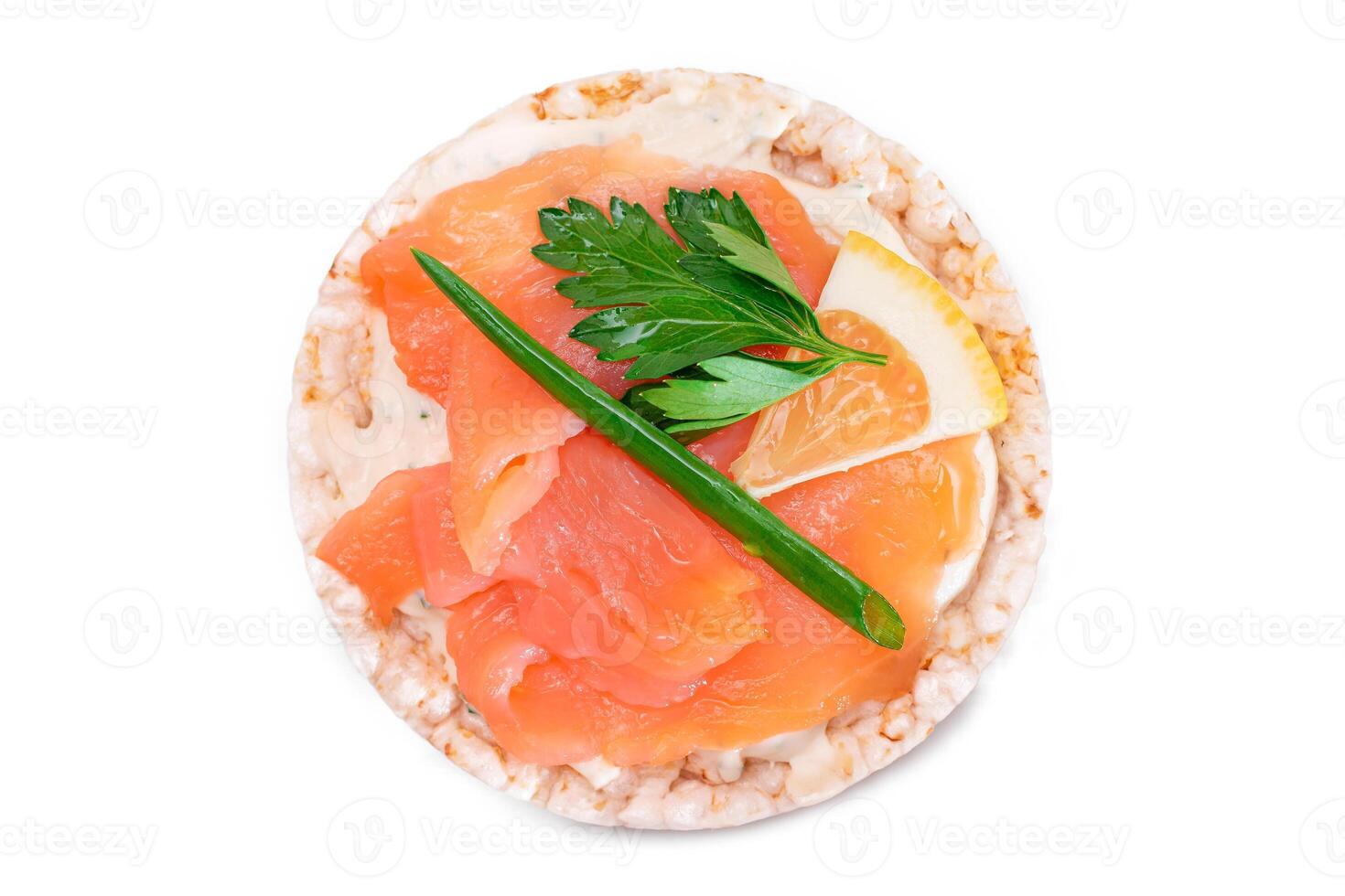 Rice Cake Sandwich with Fresh Salmon, Lemon and Greens - Isolated on White Background. Diet Food. Quick and Healthy Sandwiches. Crispbread with Fresh Fillings. Healthy Dietary Snack photo