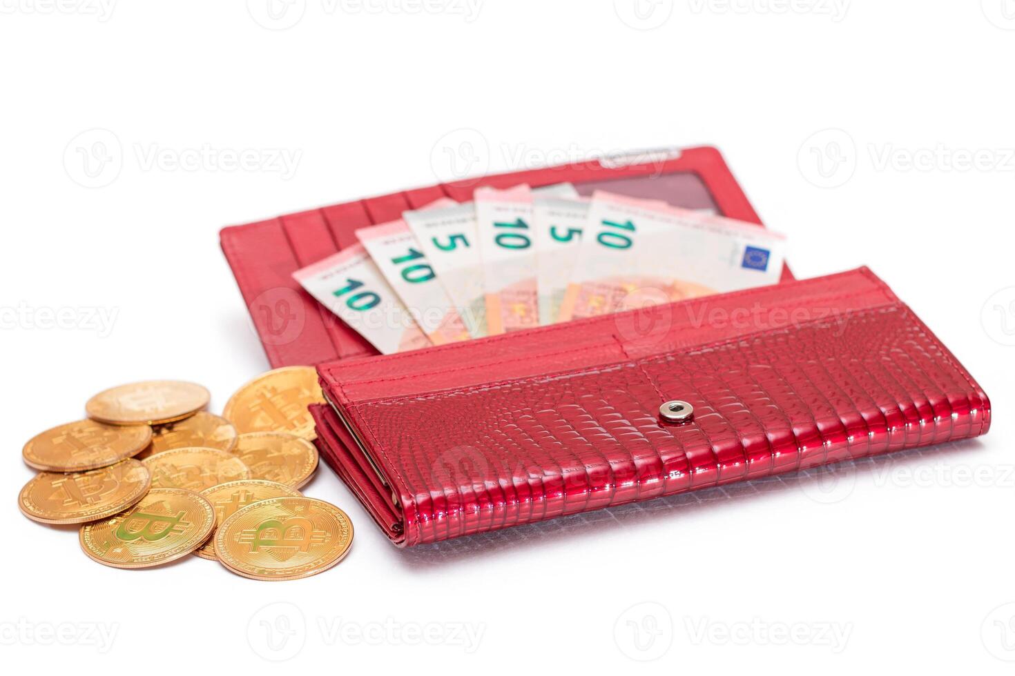 Opened Red Women Purse with 10 Euro Banknotes Inside and Bitcoin Coins - Isolated on White Background. A Wallet Full of Money Symbolizing Wealth, Success, Shopping and Social Status - Isolation photo