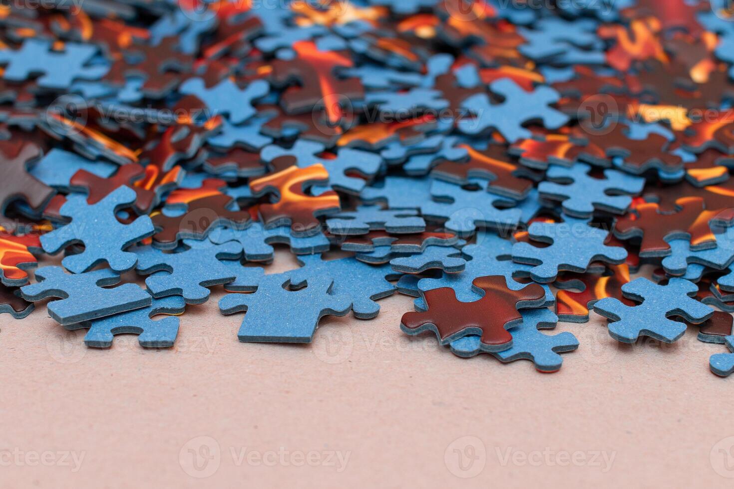 Mixed Peaces of a Colorful Jigsaw Puzzle - Strategy and Solving Problem Concept photo