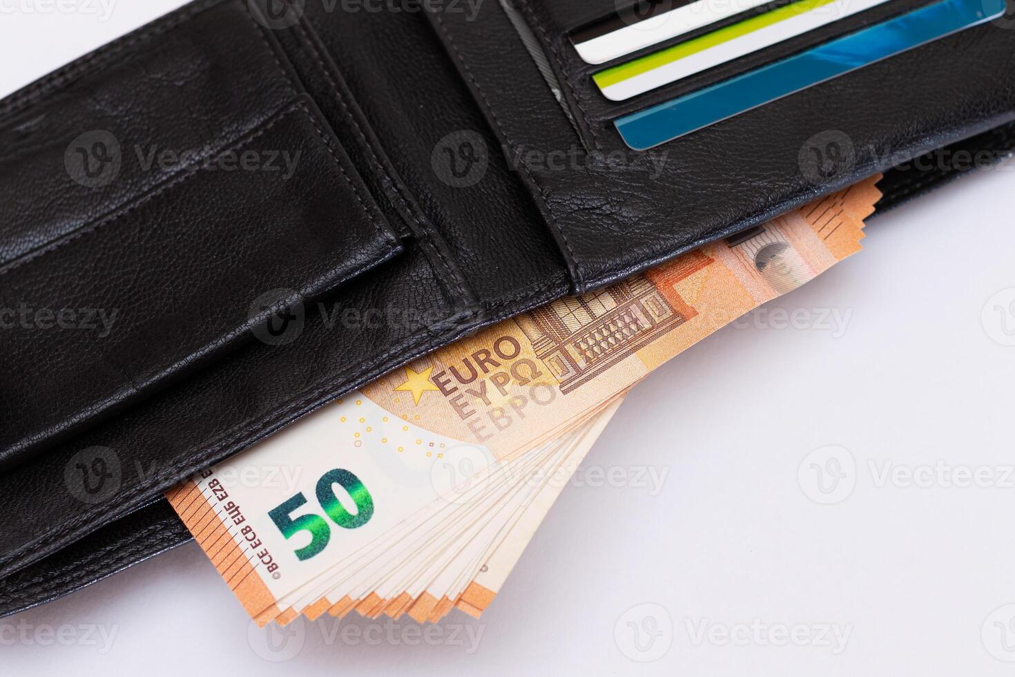 Opened Black Leather Men Wallet with Fifty Euro Banknotes and Bank Cards Inside on White Background. A Purse Full of Money and Credit Cards Symbolizing Wealth, Success and Social Status photo