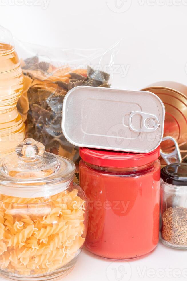 Food Reserves. Canned Food, Spaghetti, Tomato Juice, Pasta and Grocery. Emergency Food Storage in Case of Crisis. Strategic Food Supplies photo