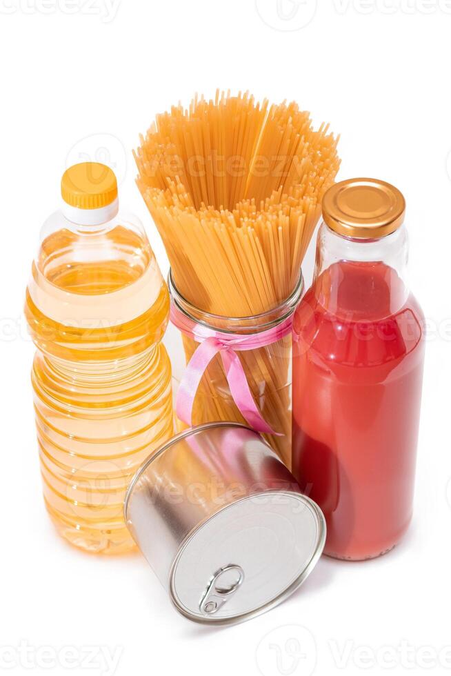 Food Reserves. Canned Food, Spaghetti, Tomato Juice, Pasta and Grocery - Isolated on White Background. Emergency Food Storage in Case of Crisis. Strategic Food Supplies - Isolation photo