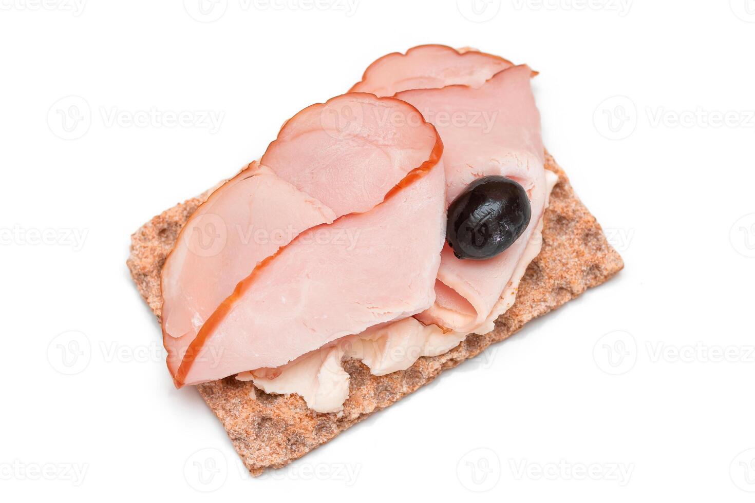 Whole Grain Crispbread with Ham, Cream Cheese and Olives - Isolated on White. Easy Breakfast. Diet Food. Quick and Healthy Sandwiches. Crispbread with Tasty Filling. Healthy Dietary Snack - Isolation photo