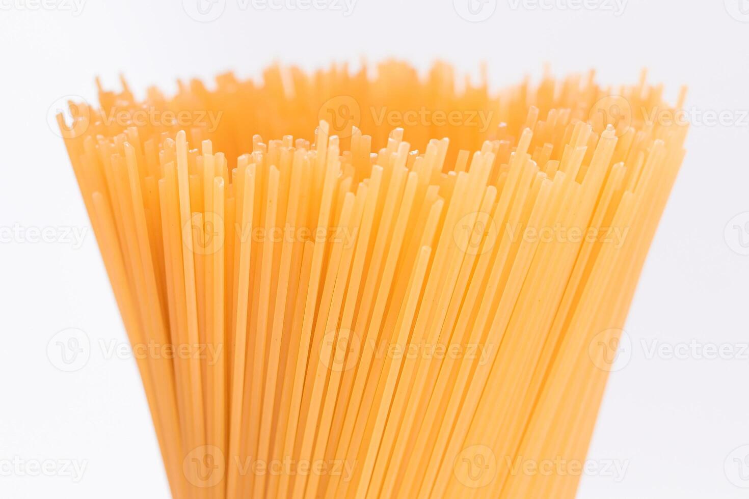 Dry Uncooked Spaghetti Isolated on White Background - Close-Up. Raw Pasta - Isolation photo
