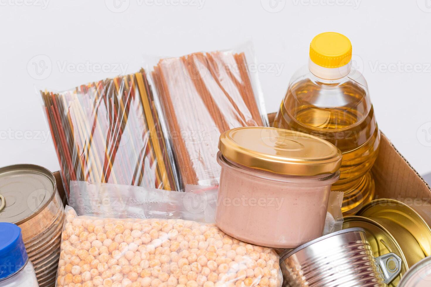 Donation Box of Free Food. Carton Box with Canned Food, Cereals and Grocery. Meal Reserves. Emergency Food Storage in Case of Crisis. Free Social Help, Blessings and Care. Strategic Food Supplies photo