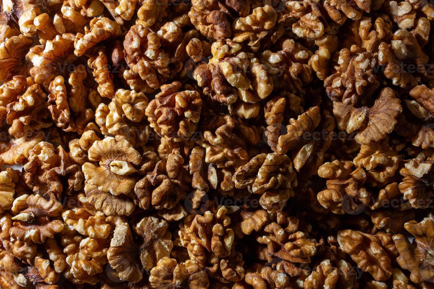 Scattered Shelled Walnuts. Background from Walnut. Natural High-Calorie Snacks photo