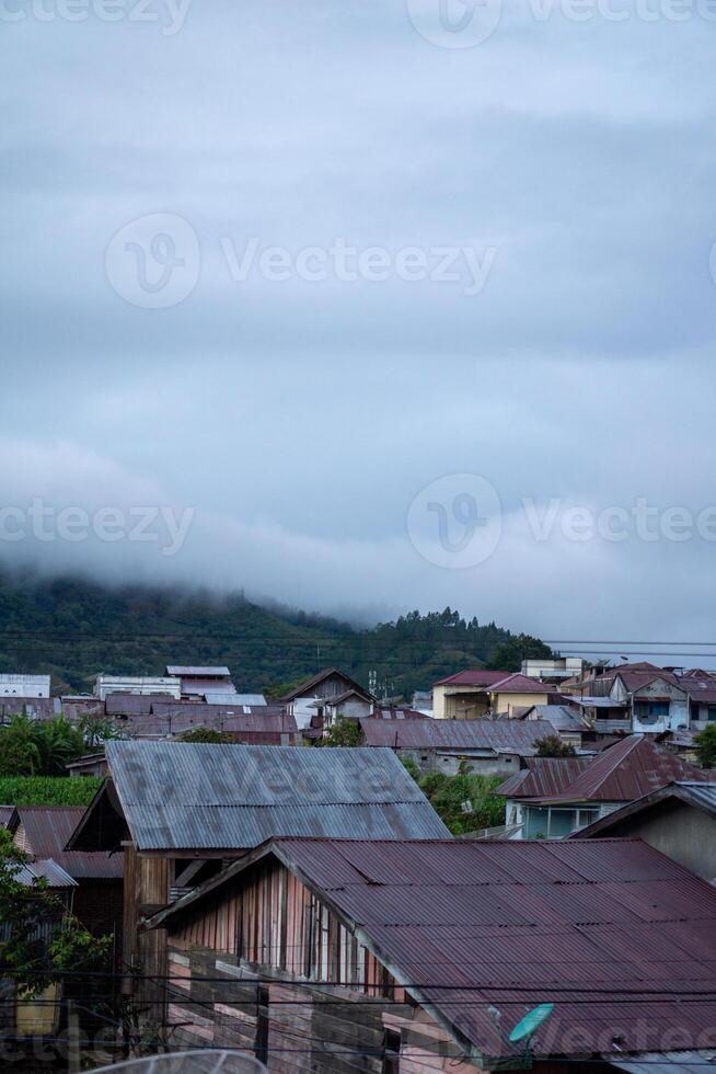 Landscape view of residents houses in Takengon city with mountain in the background. Takengon city at the morning photo