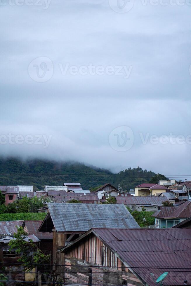 Landscape view of residents houses in Takengon city with mountain in the background. Takengon city at the morning photo