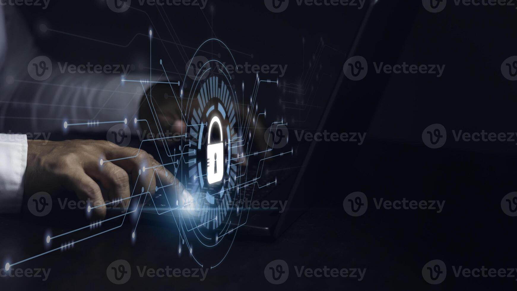 Cyber security concept. Businessman working on his laptop and select icon security on the virtual display. photo