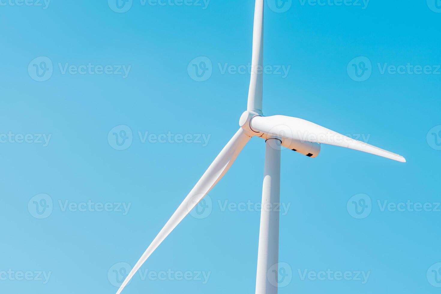 Windmills for electric power production, summer field, renewable energy photo