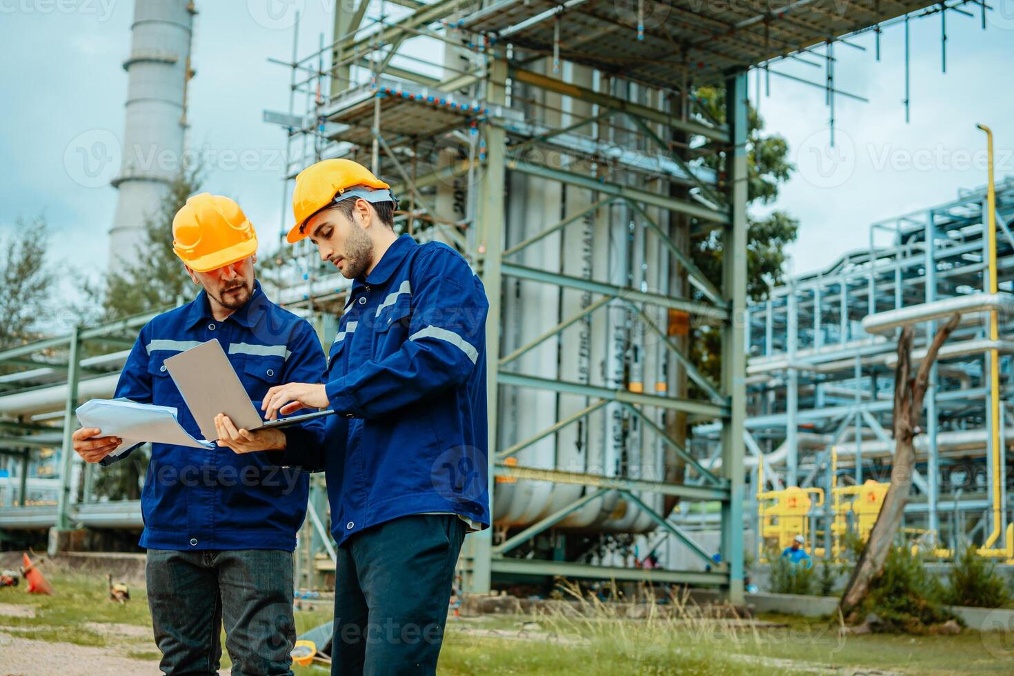 Teamwork Industry in oil refinery equipment Check and check the condition of the machinery system , Engineering concept. photo