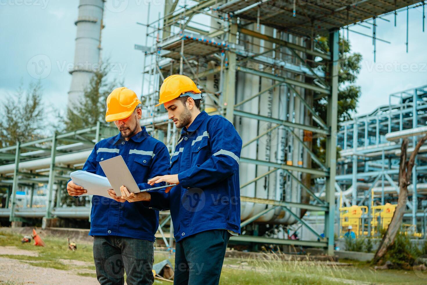 Teamwork Industry in oil refinery equipment Check and check the condition of the machinery system , Engineering concept. photo