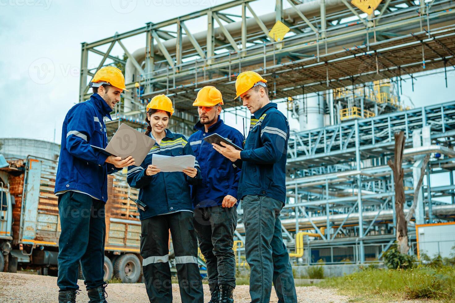 Group of workers teamwork Industry in oil refinery equipment Check and check the condition of the machinery system , Engineering concept. photo