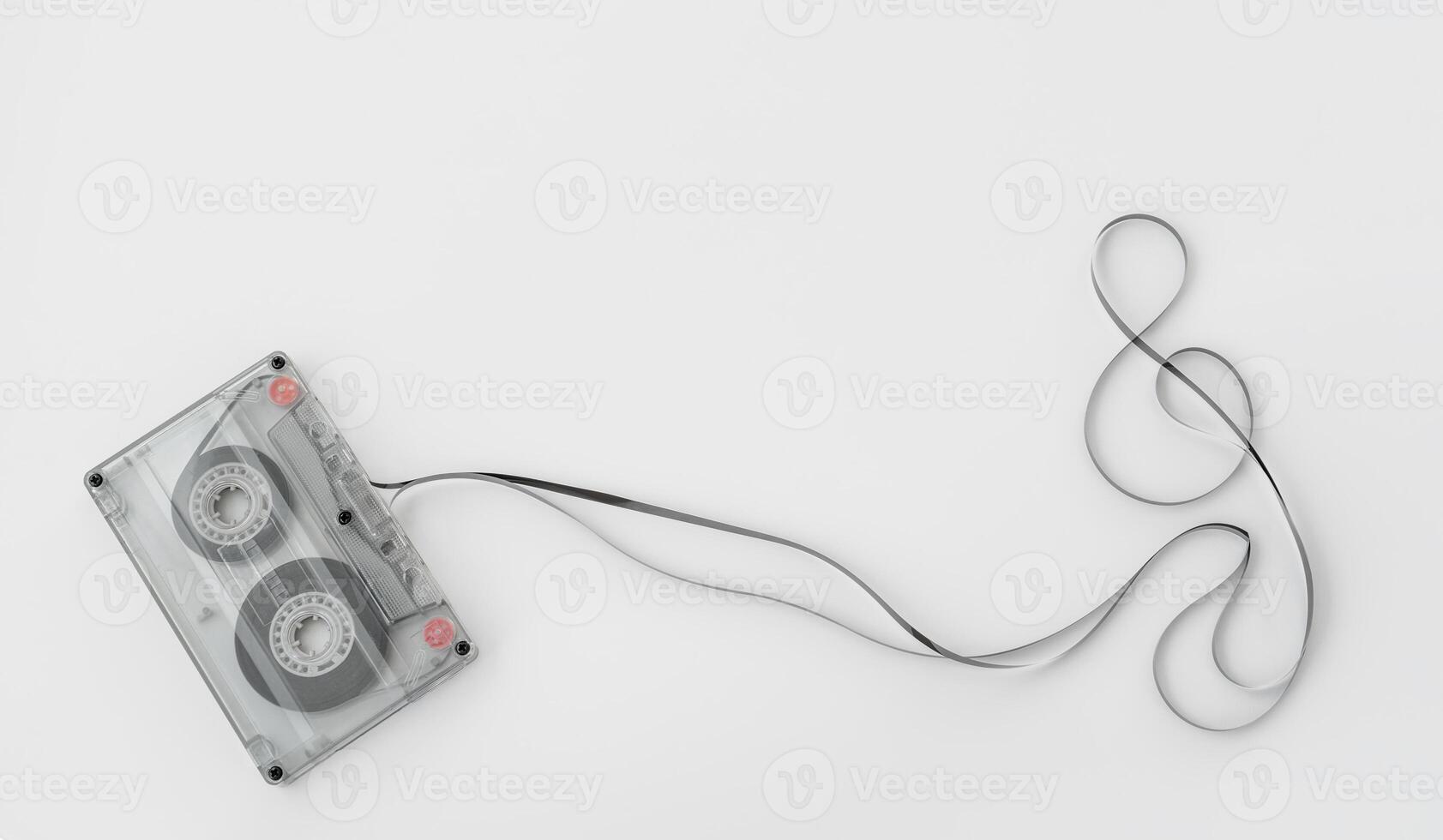 Tape coming out from musicassette with treble clef shape. photo