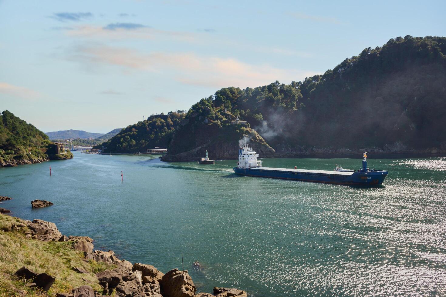 Pasaia, Guipuzcoa, Spain, 2024, View of a cargo ship leaving the port of Pasaia photo