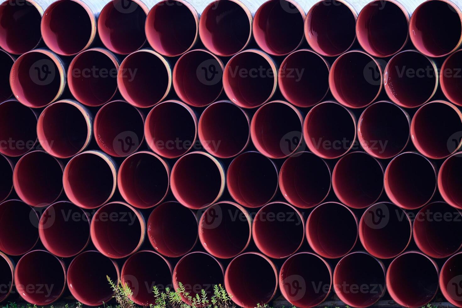 Metal pipes stacked on top of each other background. Forming a r photo