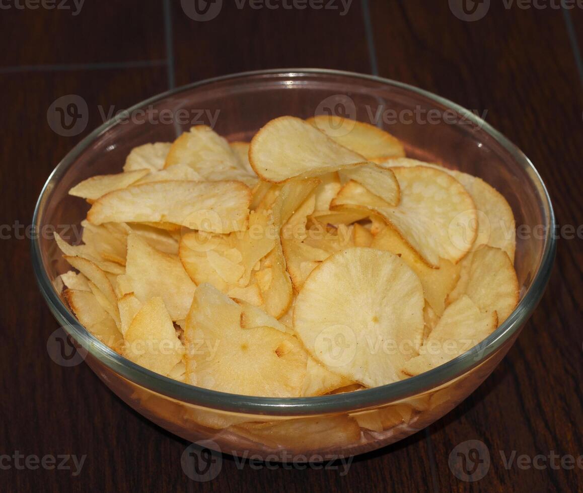 Keripik Singkong or Cassava Chips is a Indonesian traditional snack on a Served in Bowl photo
