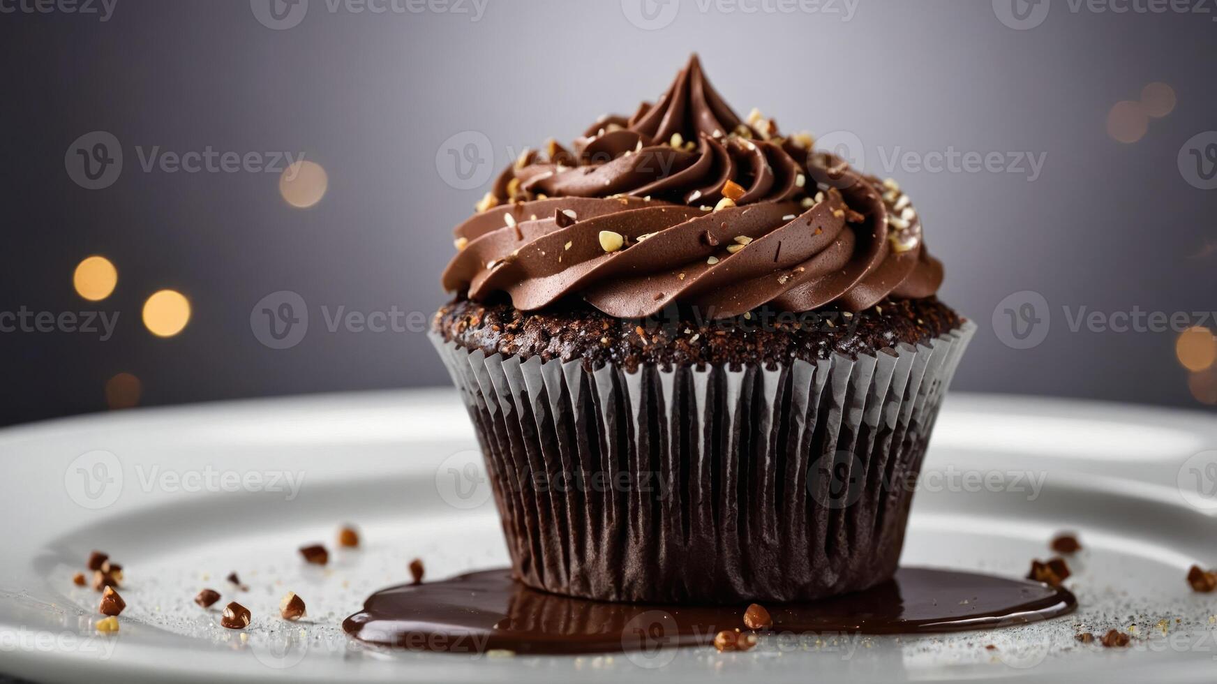 A delicious chocolate cupcake adorned with swirls of frosting and chocolate drizzle. photo