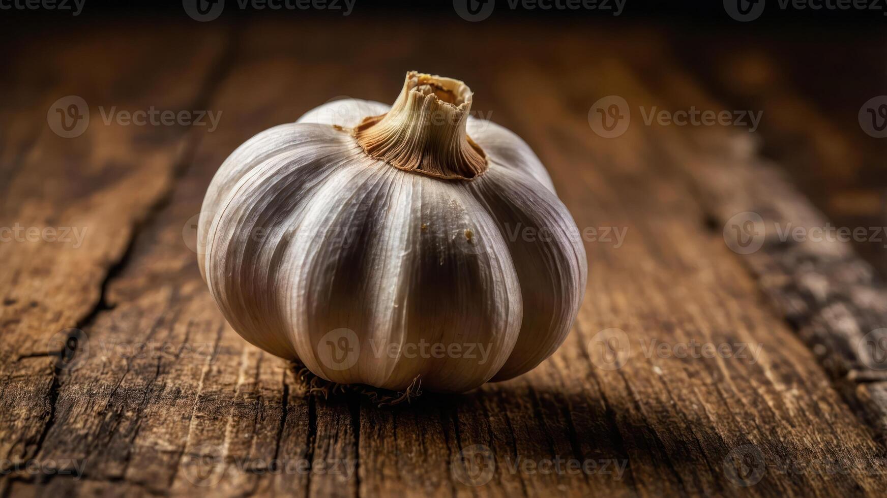 A single garlic bulb resting on a wooden surface, showcasing its texture and natural beauty. photo