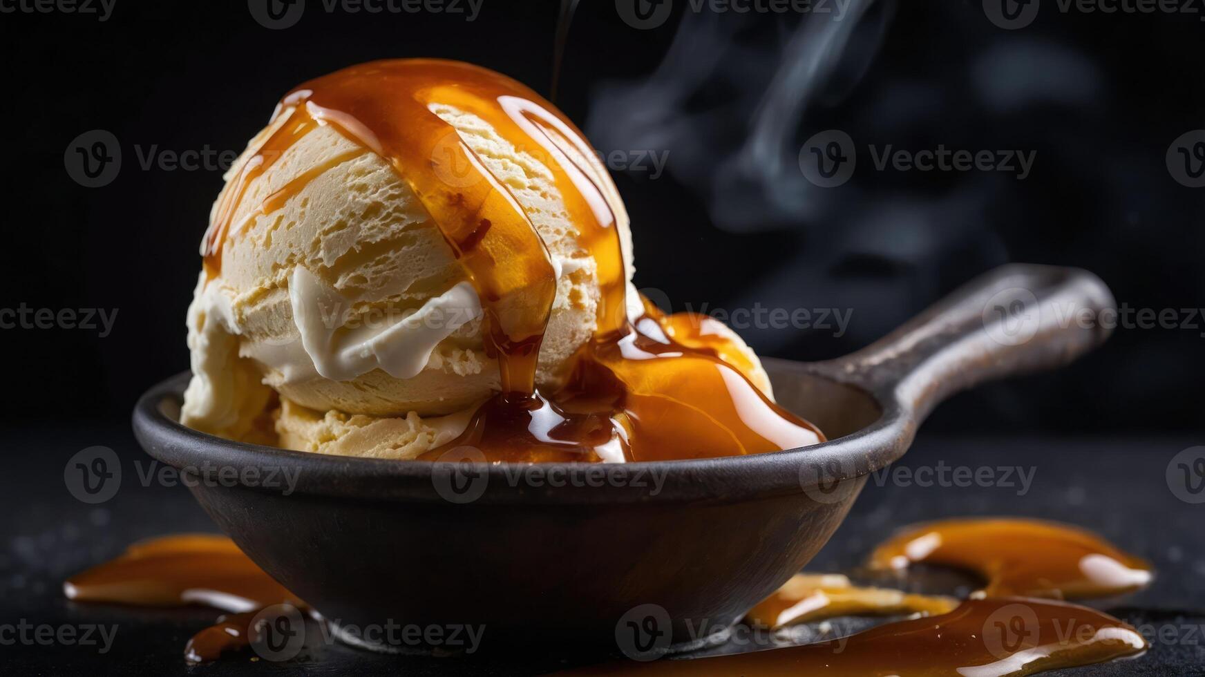 A delicious scoop of ice cream drizzled with caramel sauce in a rustic bowl. photo