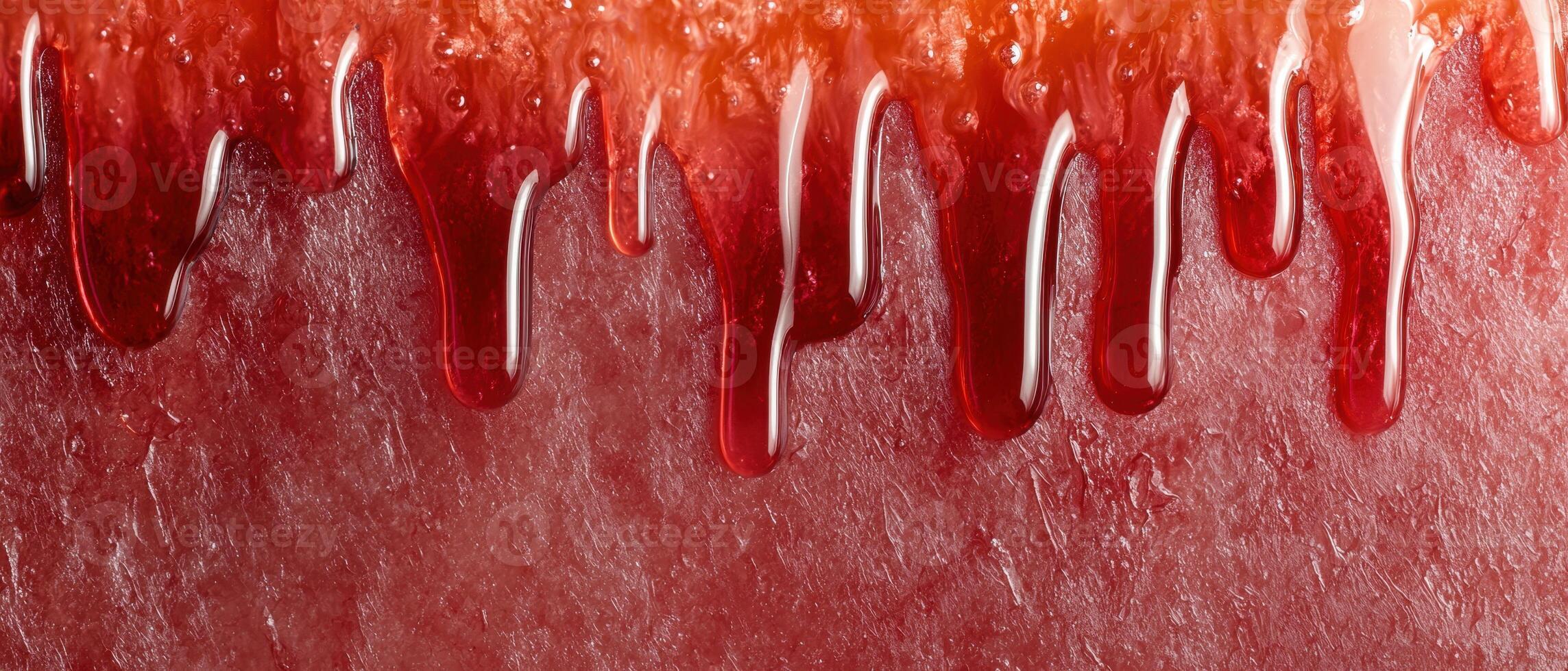 Close up of red jelly or jam dripping down photo