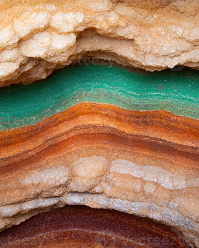 Colorful rock layers in a cave photo