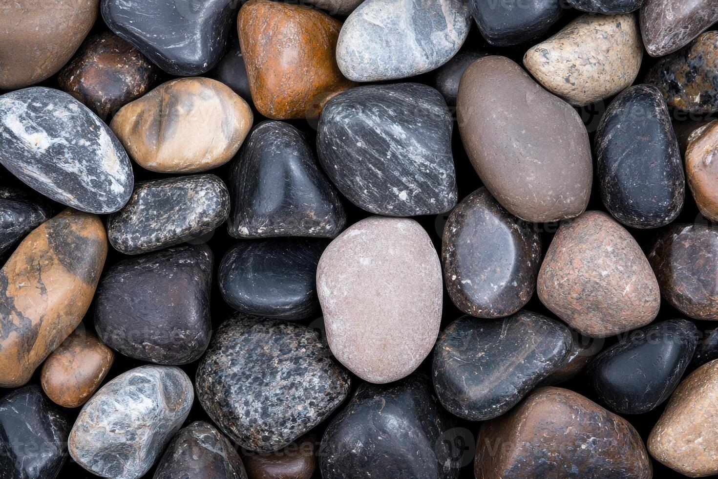Assorted smooth river rocks photo
