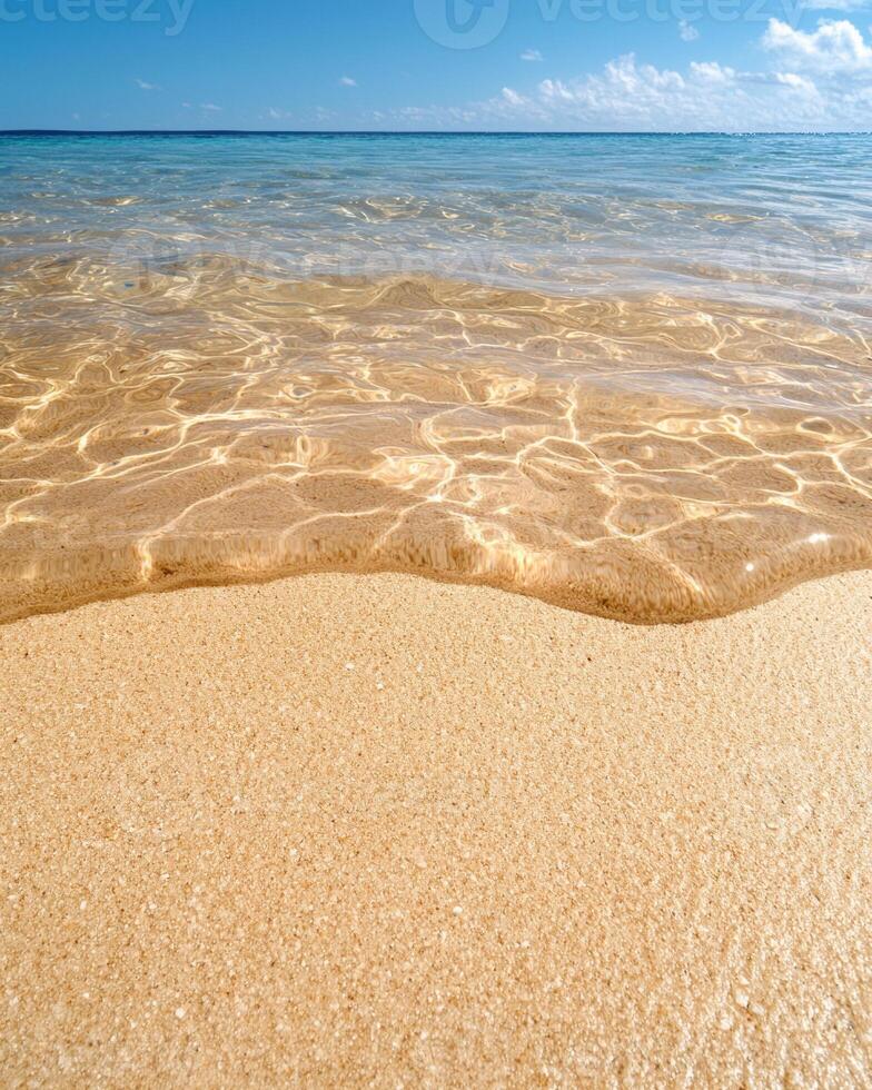 Tranquil beach scene with crystal clear water and golden sand photo