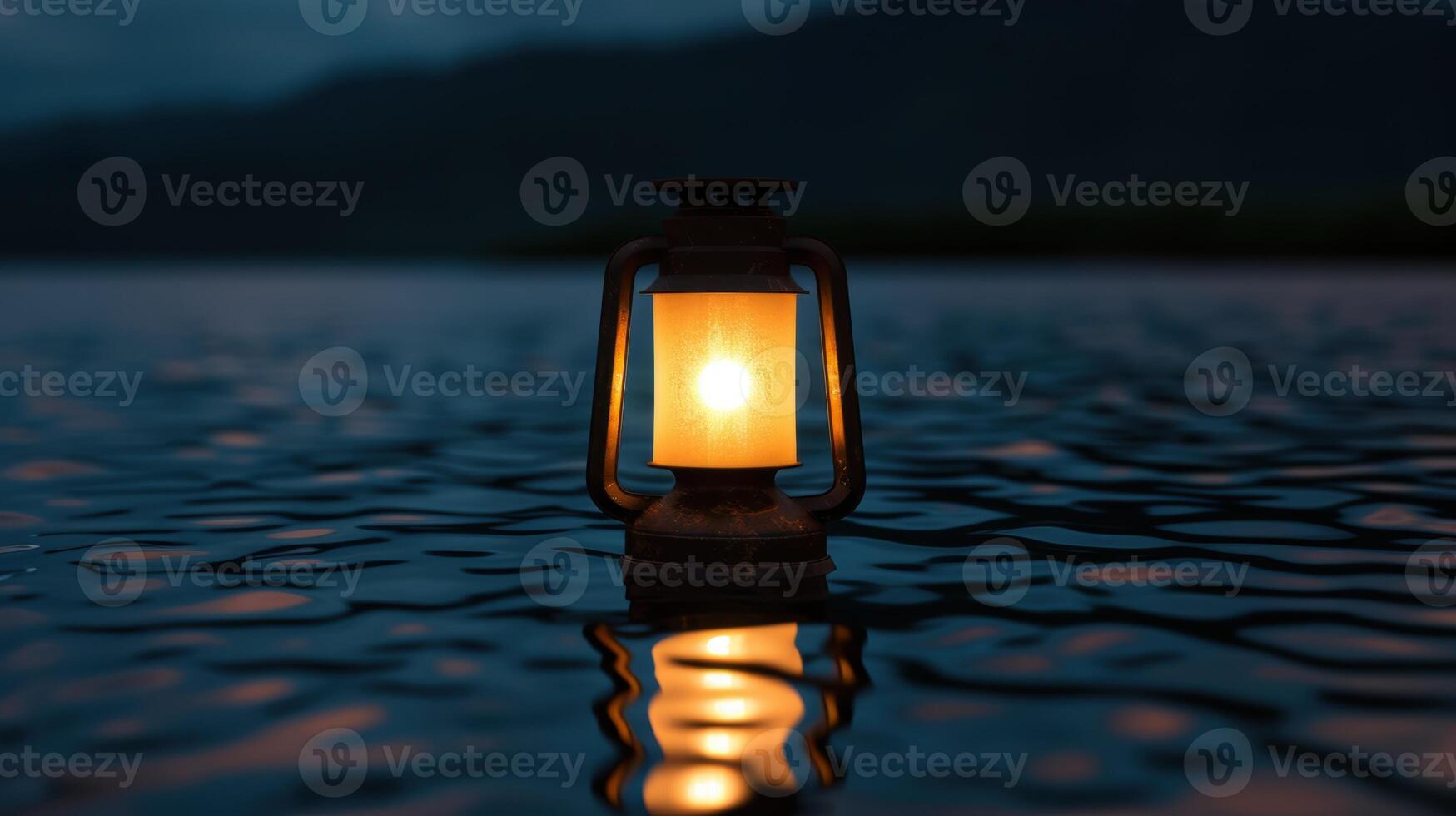 Glowing lantern on a serene lake at night photo