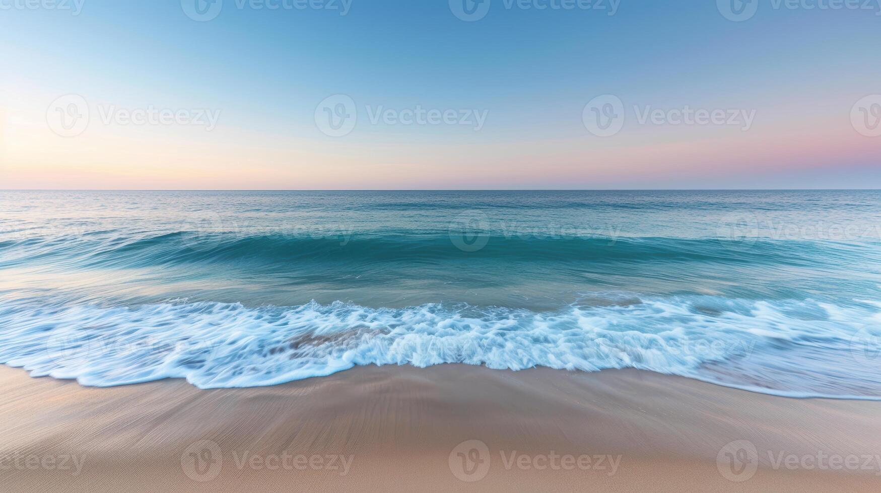 serene ocean waves lapping on sandy beach at sunset photo