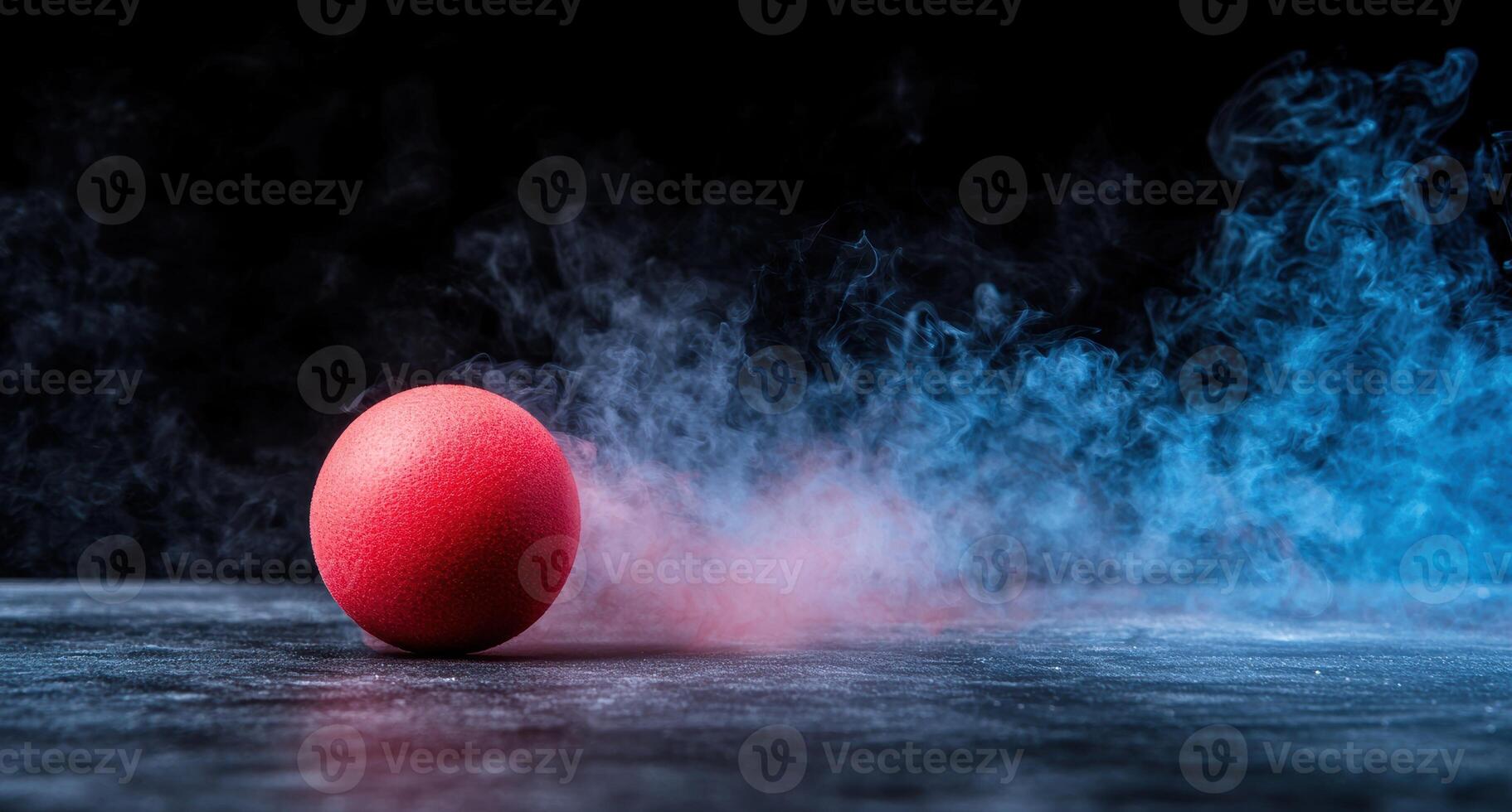 Dramatic smoke and red ball on dark background photo