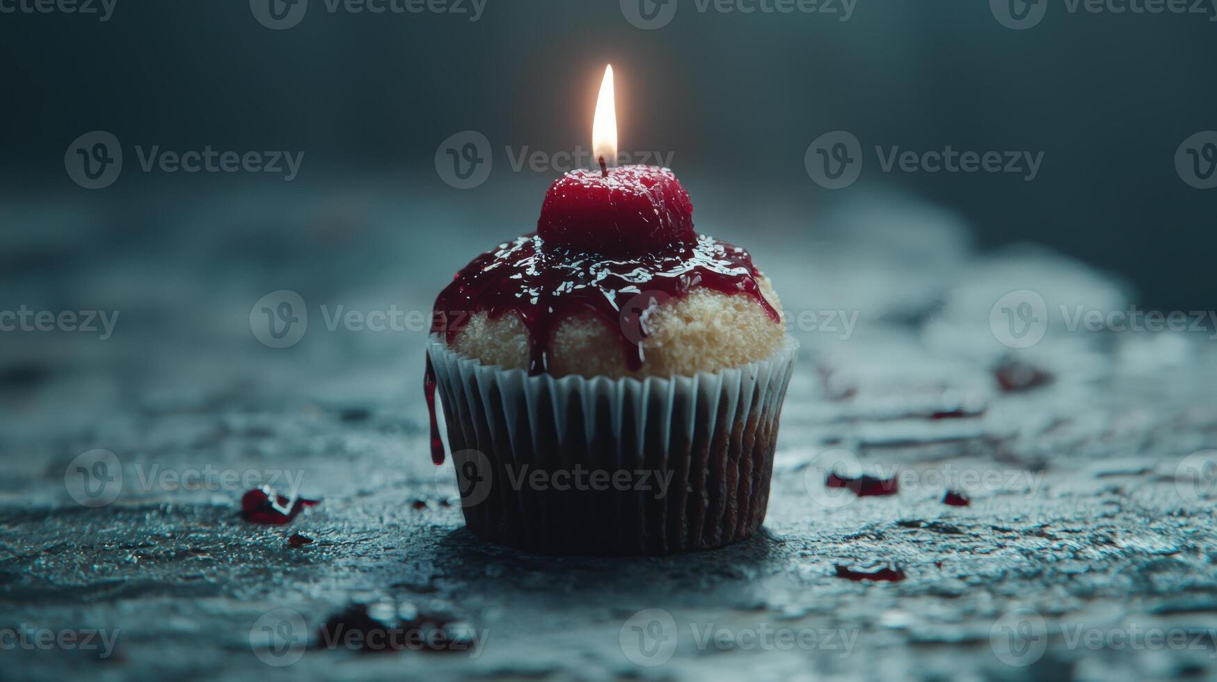 Delicious cupcake with lit candle on dark background photo