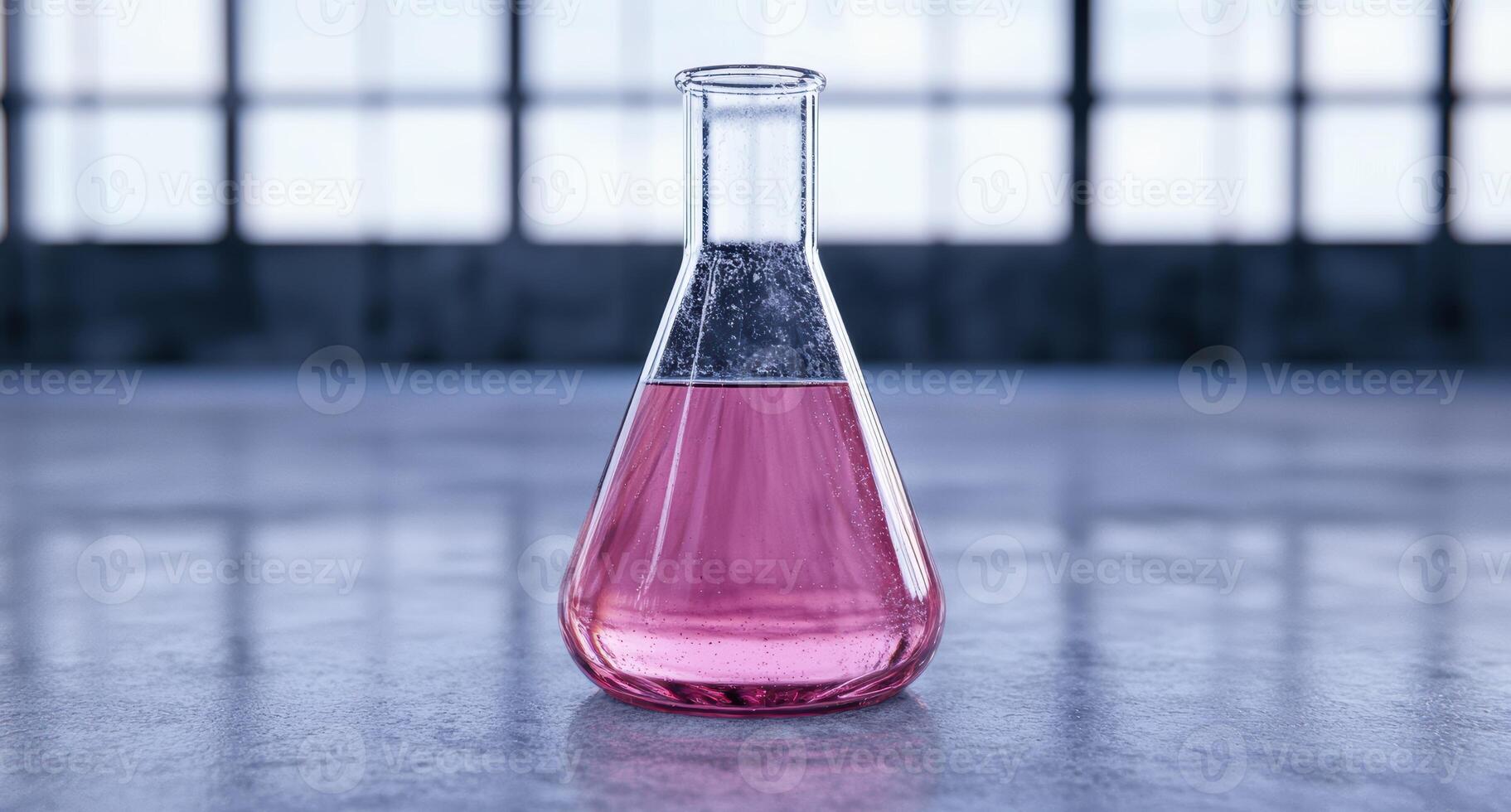 glass beaker with pink liquid photo