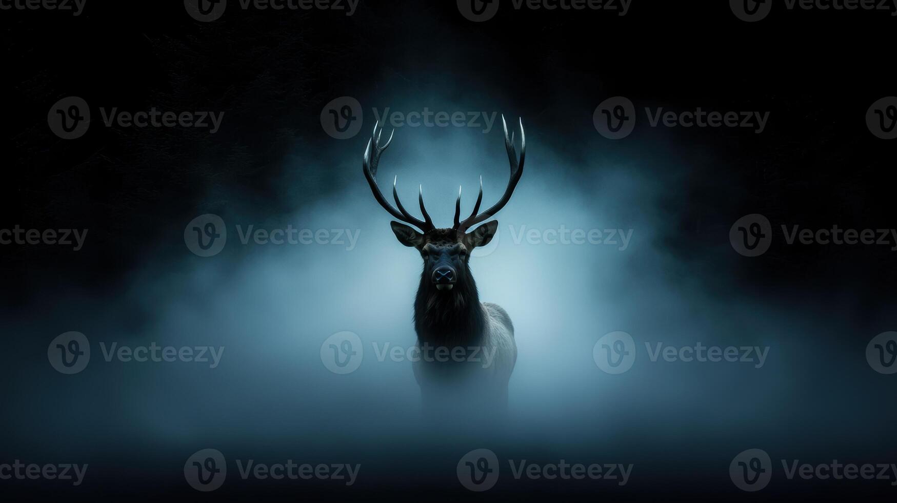 Majestic deer with large antlers in misty forest photo