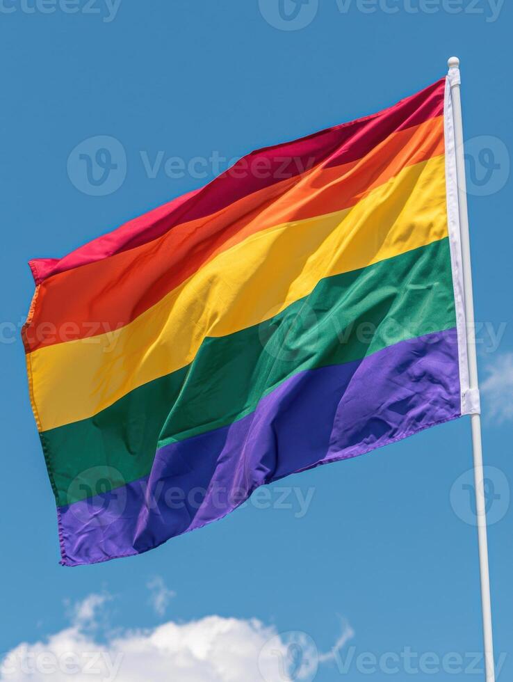 colorful pride flag waving in the sky photo