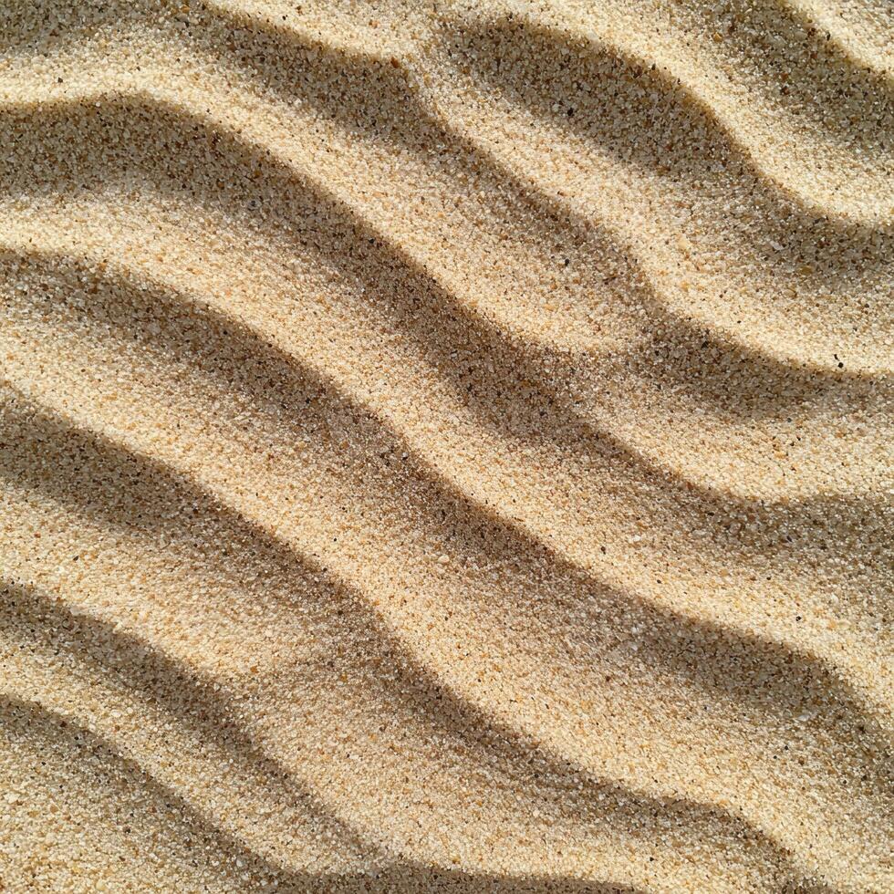 Textured sand pattern in sunlight photo