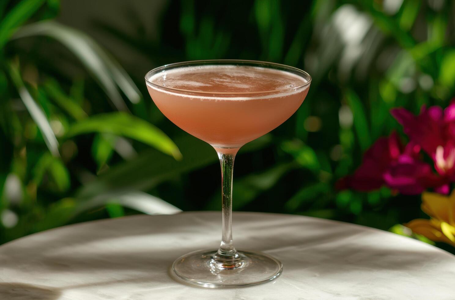 Refreshing tropical cocktail in a garden setting photo